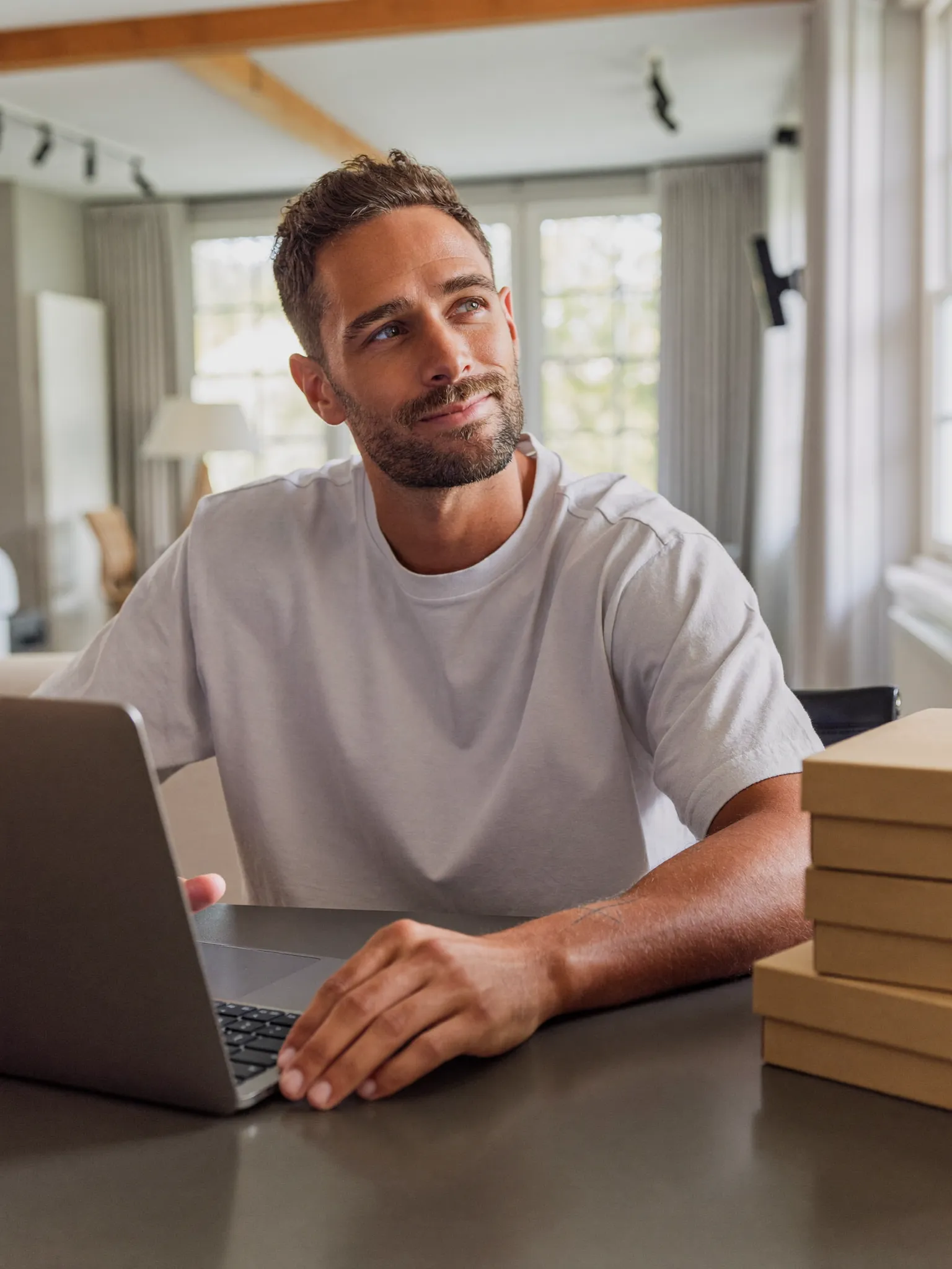 Seller running his eBay store from a laptop